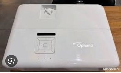 an image of a close up of a small white device on a table