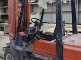 a forklift truck that is parked inside of a building