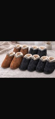 four pairs of slippers are lined up on a bed