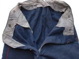 a close up of a pair of jeans with a zipper down the side