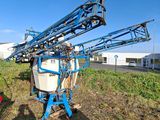 a tractor with a sprayer attached to the back of it