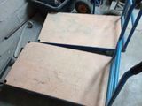 a cart that is sitting on the floor next to a box