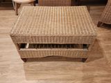 an image of a wicker coffee table with a drawer underneath it