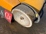 a close up of a machine that is sitting on the ground