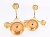 pair of gold plated brass candlesticks with a black diamond