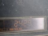 a close up of a digital clock on the dashboard of a car