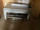 an image of a microwave sitting on a table in a room