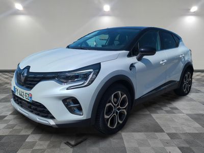 a white renault c - cross suv parked on a checkered floor