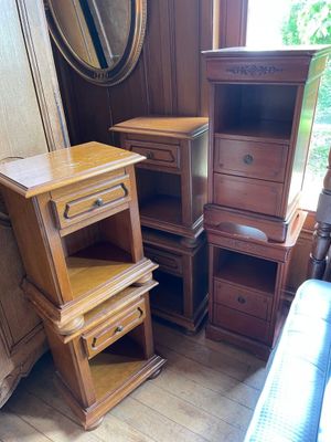 three wooden drawers and a dresser in a room