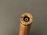 a close up view of a bullet on a table