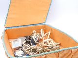 a box with a bunch of jewelry inside of it
