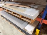 several pieces of wood are stacked on a pallet in a warehouse