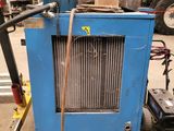 a blue machine that is sitting in a garage