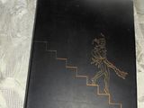 a black book with a drawing of a man on it