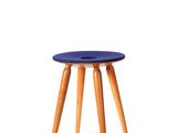a small blue stool with wooden legs on a white background