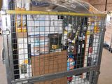 a large metal cage filled with bottles and boxes