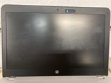 a laptop computer sitting on top of a table
