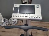 a tread machine with a monitor on top of it