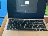 an apple mac laptop computer sitting on top of a wooden desk