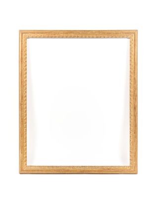 a gold frame on a white wall with a white background