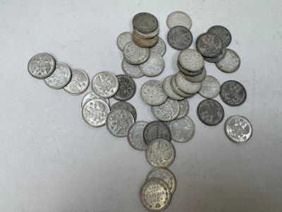 a lot of coins that are on the table
