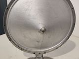 an image of a silver metal object on a white table