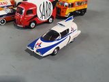 several toy cars are lined up in a row on a table