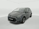 a grey citrole is parked in a white room