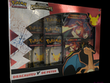 a box of pokemon cards with a picture of a dragon