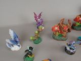 many figurines of different types and colors on the table