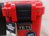 a red yeti toolbox with a tag on it