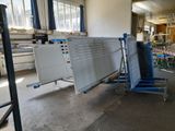 a blue cart that is sitting in the middle of a room