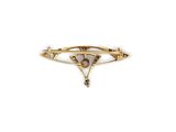 a close up of a gold and white broochle broochle on a white background