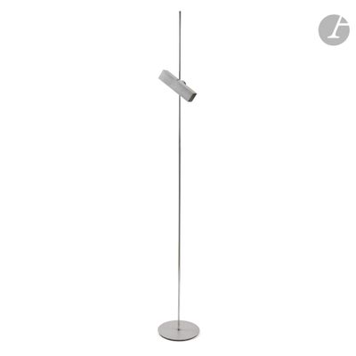 the floor lamp is standing on a metal base and has a white base