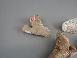 three figurines that are sitting on a table