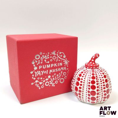 a red box with a red and white apple next to it