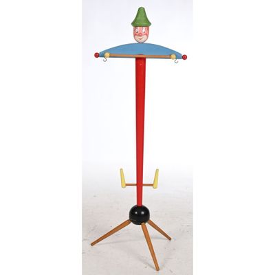 a wooden toy on a stand with a hat on top of it