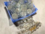 a crate of empty plastic water bottles on the floor