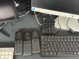 a computer desk with a keyboard, monitor, and mouse