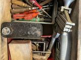 a wooden box filled with assorted tools and tools