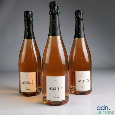 three bottles of wine sitting next to each other on a table