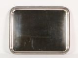 rectangular silver plate with beaded edge on a white background
