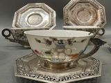 a cup and saucer set on a tray on a table