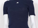 the top of a mannequin mannequin wearing a blue sweater