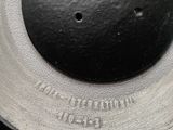 a close up of a metal object with a hole in it