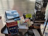 a pile of books on a desk next to a window