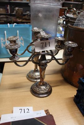 a silver candelier on a table in a store