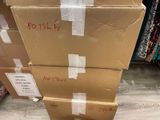 several cardboard boxes stacked on top of each other in a store
