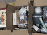 two boxes with different items inside of them on the floor