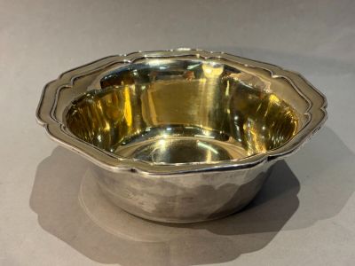 a silver bowl that is sitting on a table